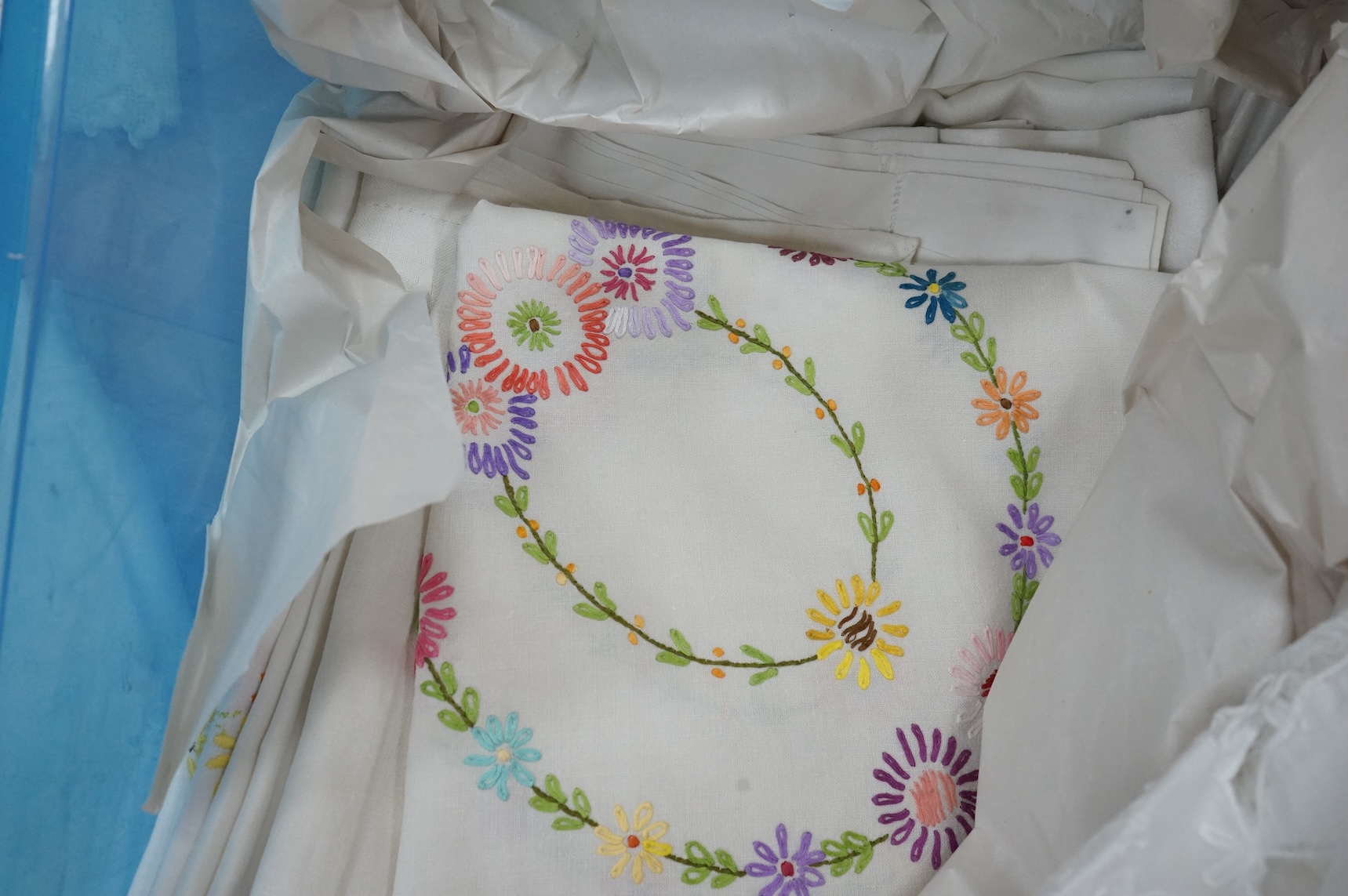 A collection of early 20th century and later crochet, cut work and drawn thread table linens and a large embroidered table cloth